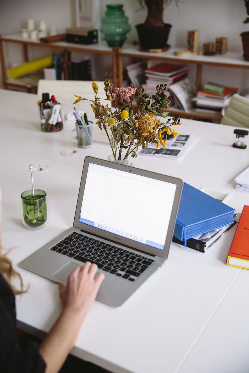 photo of laptop on white table